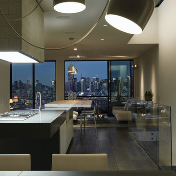 Kitchen, lounge and evening city skyline.
