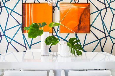 Trendy carpeted, gray floor and wallpaper dining room photo in Atlanta with multicolored walls