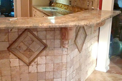 Example of a large transitional l-shaped ceramic tile and beige floor open concept kitchen design in Austin with a double-bowl sink, raised-panel cabinets, white cabinets, granite countertops, beige backsplash, ceramic backsplash and a peninsula