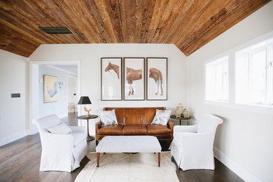 Small farmhouse formal and enclosed dark wood floor and brown floor living room photo in Other with white walls, no fireplace and no tv