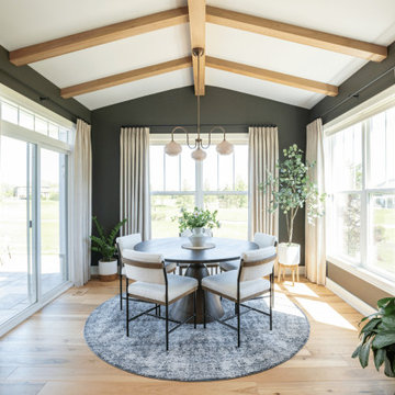 Vaulted Ceiling Breakfast Nook with Exposed Wood Beams & Globe Chandelier