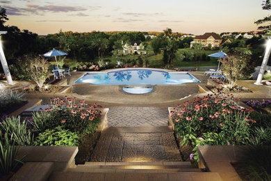 Large elegant backyard stone and custom-shaped lap hot tub photo in DC Metro