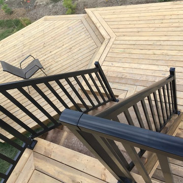 Multiple levels deck with a storage space and a hut-tub place