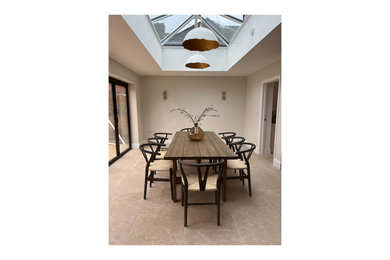 This is an example of a large classic conservatory in Berkshire with porcelain flooring and a skylight.