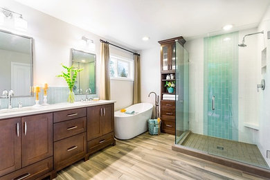 Trendy master blue tile light wood floor bathroom photo in Other with an undermount sink, recessed-panel cabinets, medium tone wood cabinets and white walls