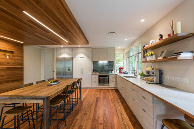 Contemporary eat-in kitchen in Christchurch with an undermount sink, light wood cabinets, stainless steel appliances and medium hardwood floors.