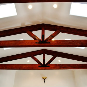 Vaulted ceiling with exposed beam trusses