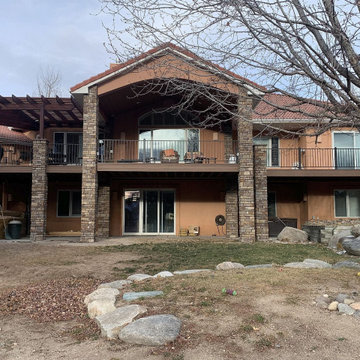 930 SF composite deck with stone columns, 364 SF cedar pergola, steel deck raili