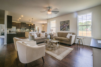 Mid-sized trendy open concept dark wood floor and brown floor living room photo in DC Metro with white walls, no fireplace and a tv stand