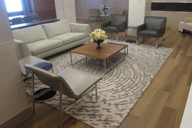 Inspiration for a huge contemporary open concept ceramic tile and brown floor living room remodel in New York with a hanging fireplace, a stone fireplace and no tv