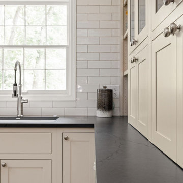 Warm Traditional Kitchen Remodel with Cream Cabinets & Herringbone Floors