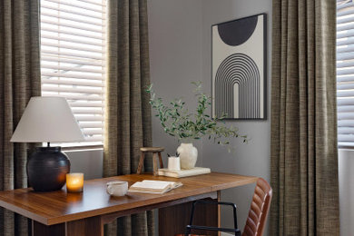 Study room - mid-sized transitional freestanding desk light wood floor and brown floor study room idea in Atlanta with gray walls