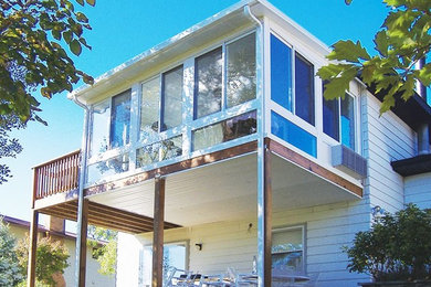 Deck - mid-sized backyard deck idea in Minneapolis with a roof extension