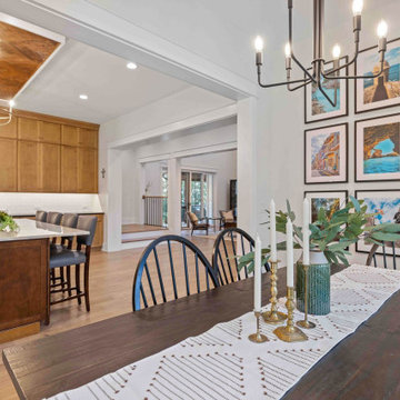 Elegant Modern Farmhouse Dining Room: Travel Gallery Wall, Rustic Table, and Pan