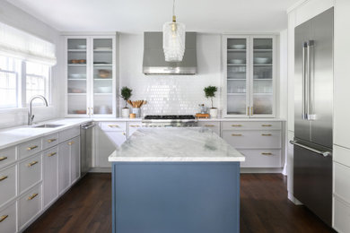 Eat-in kitchen - transitional u-shaped dark wood floor eat-in kitchen idea in New York with granite countertops, white backsplash, stainless steel appliances, an island, white countertops, ceramic backsplash and shaker cabinets
