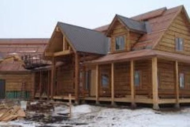 Large brown two-story wood exterior home photo in Boise