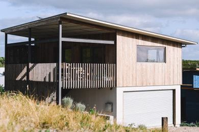 Photo of a beach style home design in Perth.