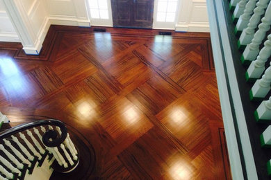 Staircase - mid-sized traditional wooden curved staircase idea in New York with painted risers
