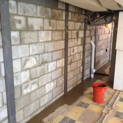 Tie backs installed and footer and reinforced wall in front between steel buttre - Products