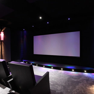 Inspiration for a mid-sized modern enclosed carpeted and gray floor home theater remodel in Bordeaux with a projector screen