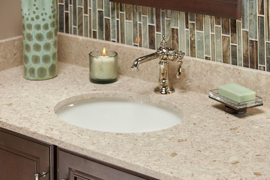 Bathroom - mid-sized transitional 3/4 brown tile, green tile and matchstick tile bathroom idea in Atlanta with beaded inset cabinets, dark wood cabinets, beige walls, an undermount sink and quartz countertops