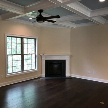 Family room with coffer ceiling & fireplace!