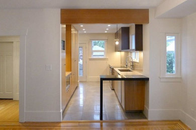 Kitchen - modern kitchen idea in Vancouver