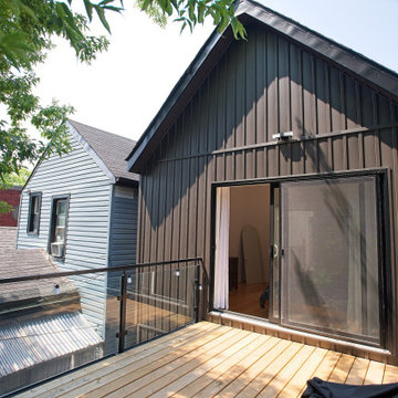 Angled View of the Dark Metal Addition and Upper Wood Deck | East York