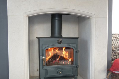 Clearview Vision wood burning stove in Cotswold stone fireplace