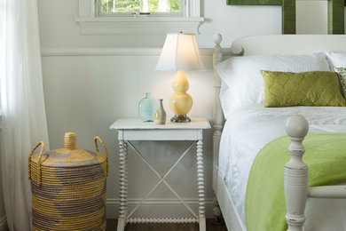 Inspiration for a shabby-chic style medium tone wood floor and brown floor bedroom remodel in Burlington with white walls