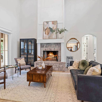 Cozy Modern Farmhouse Living Room: Stone Fireplace, Vaulted Ceilings, Loft Libra