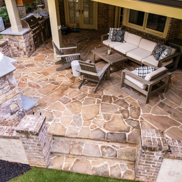 Covered Outdoor Patio with Stone Flooring and Lounge Seating