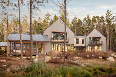 Mid-sized rustic two-story wood house exterior idea in Portland Maine