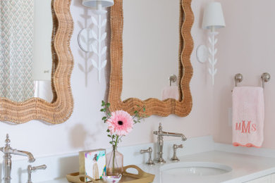 Inspiration for a timeless kids' double-sink bathroom remodel in Nashville with recessed-panel cabinets, white cabinets, pink walls, an undermount sink, white countertops and a built-in vanity