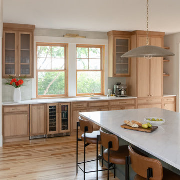 Warm Modern Kitchen Renovation with Natural Oak & Green Accents