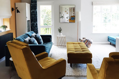 Inspiration for a medium sized contemporary grey and yellow enclosed living room curtain in Hampshire with grey walls, carpet, a freestanding tv and beige floors.