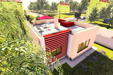 Inspiration for a small modern beige two-story brick exterior home remodel in Other with a mixed material roof
