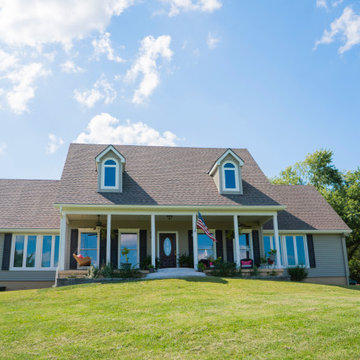 Seamless Polymer Siding in Mountain Clay w/ Energy Efficient Replacement Windows
