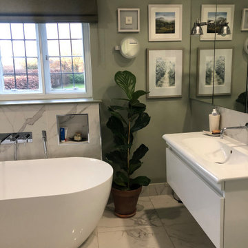 Airy, boutique-style ensuite bathroom with egg bath