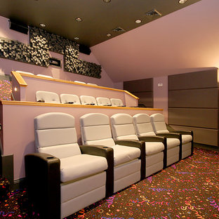 Design ideas for a large traditional enclosed home cinema in Chicago with pink walls, carpet and a projector screen.