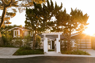 Example of a beach style home design design in San Diego