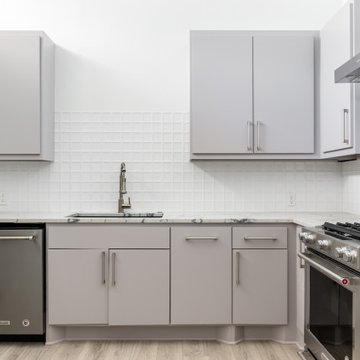 Commercial Office Kitchen with Kitchen Aid Appliances, Grey Custom Cabinets, and