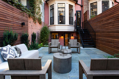 Example of a transitional patio design in New York