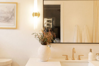 Inspiration for a mid-sized contemporary master white tile and ceramic tile porcelain tile, black floor and single-sink bathroom remodel in Orange County with shaker cabinets, brown cabinets, white walls, a drop-in sink, quartz countertops, white countertops, a niche and a freestanding vanity
