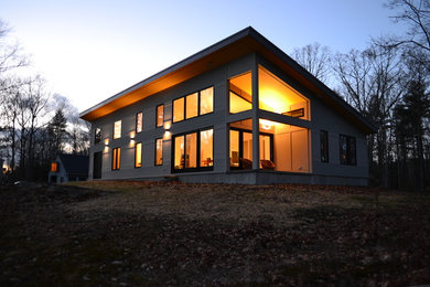 Mid-sized contemporary gray one-story wood exterior home idea in Boston