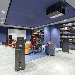 Design ideas for a large contemporary open plan home cinema in Madrid with purple walls, painted wood flooring and a projector screen.