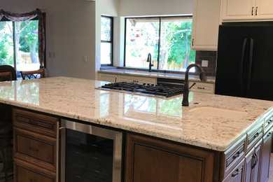 Inspiration for a large timeless u-shaped laminate floor, multicolored floor and exposed beam kitchen pantry remodel in Sacramento with shaker cabinets, an island, a single-bowl sink, white cabinets, quartz countertops, black appliances, white countertops, brown backsplash and brick backsplash