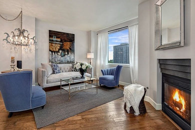 Mid-sized trendy formal and open concept medium tone wood floor living room photo in Seattle with gray walls, a standard fireplace, a metal fireplace and no tv