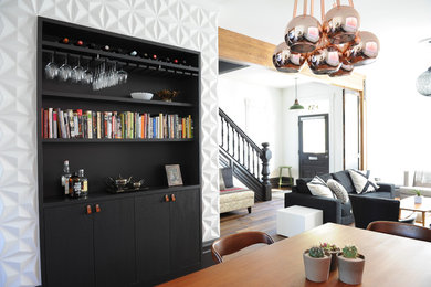 Inspiration for a mid-sized eclectic open plan dining in Vancouver with white walls and medium hardwood floors.