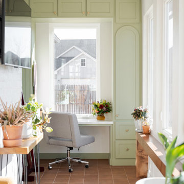 Arched Built-Ins Meet Terracotta Tile in a Light-Filled Sunroom Addition